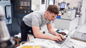 man working on computer industry 4.0